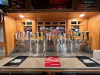 a bar with a lot of beer taps